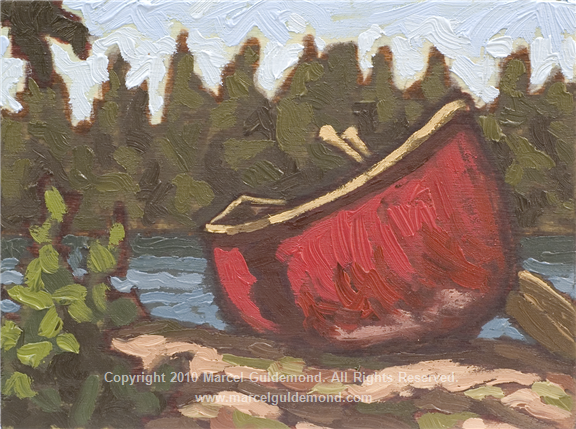 red canoe and paddles